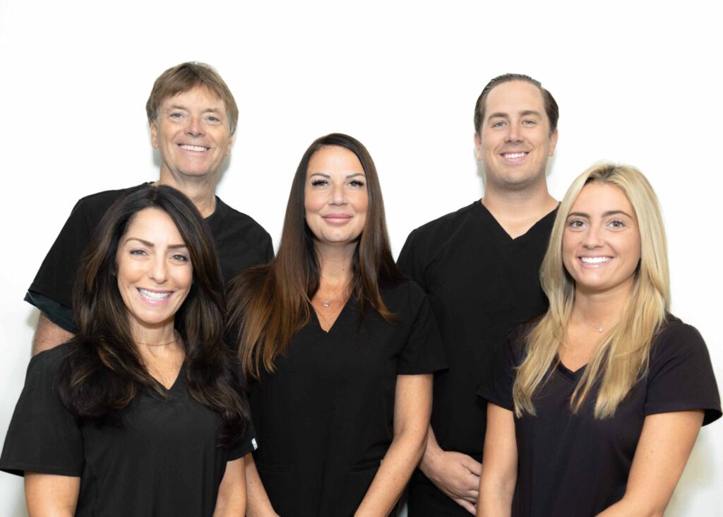 group photo of staff with white background