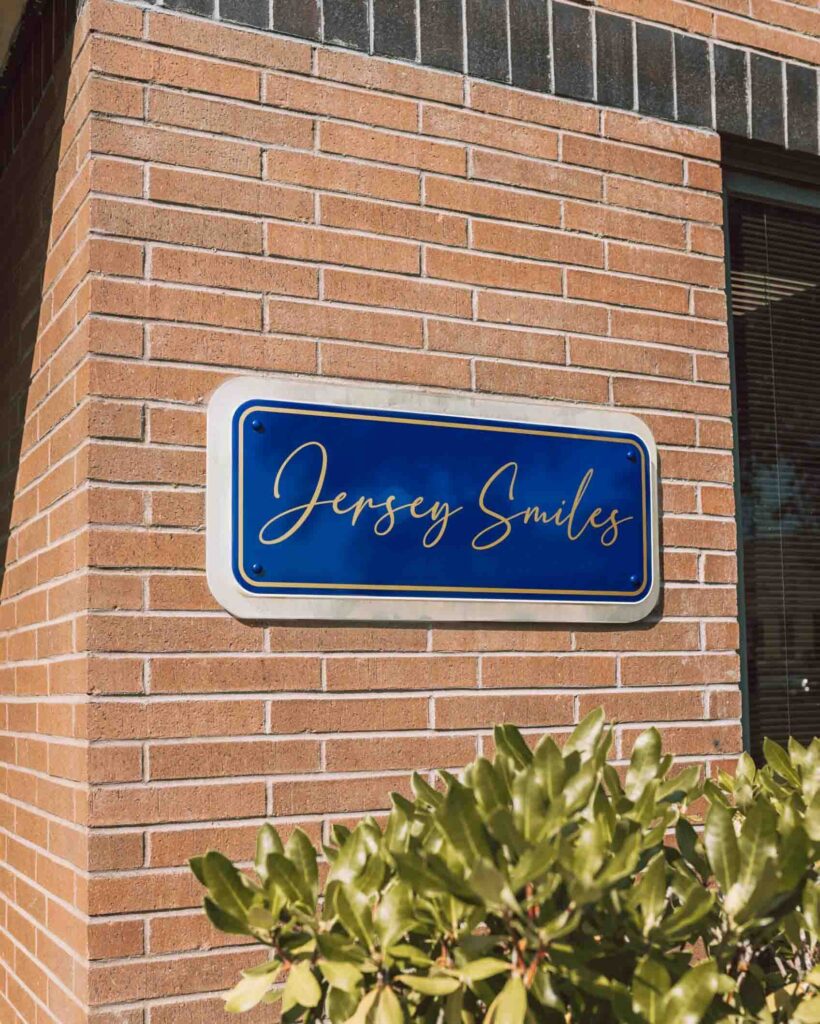 outdoor Jersey Smiles logo on brick wall